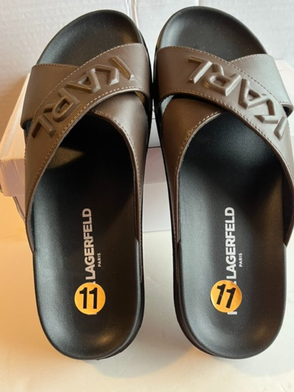 Karl Lagerfeld Paris men’s Chandler crisscross sandals.